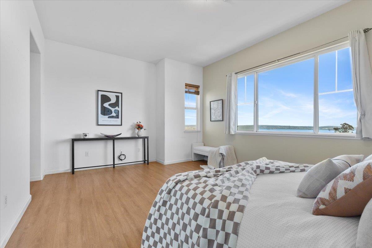 133 Cliff Swallow Court Brisbane, CA 94005 - Photo 21 of 39 a bedroom with a bed and a window