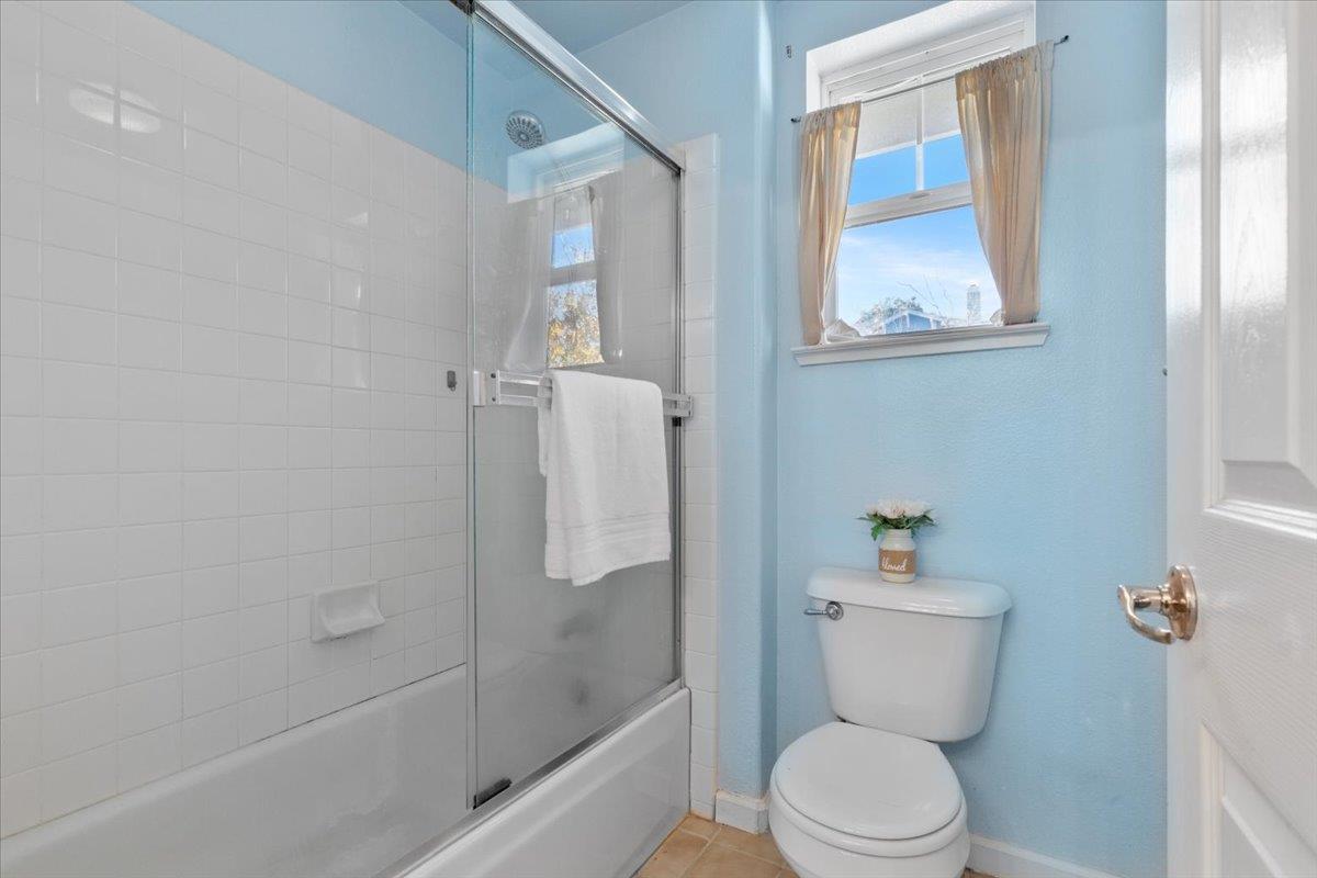 133 Cliff Swallow Court Brisbane, CA 94005 - Photo 24 of 39 a white toilet sitting next to a bath tub shower