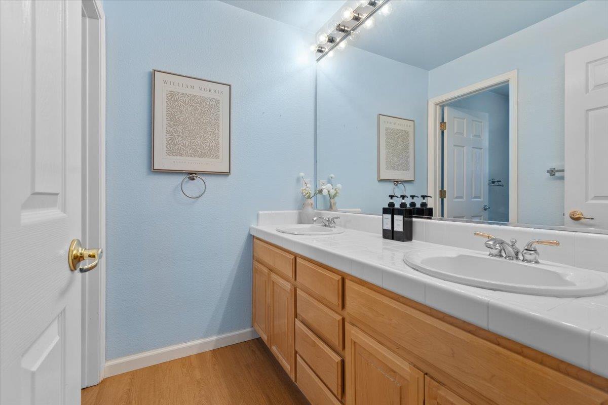 133 Cliff Swallow Court Brisbane, CA 94005 - Photo 25 of 39 a bathroom with a sink and a mirror