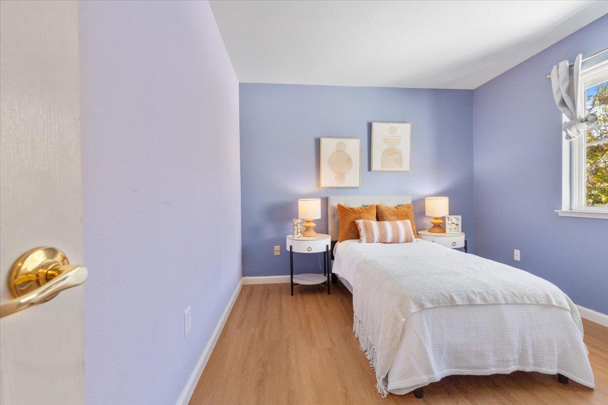 133 Cliff Swallow Court Brisbane, CA 94005 - Photo 28 of 39 a bedroom with a bed and painting on the wall