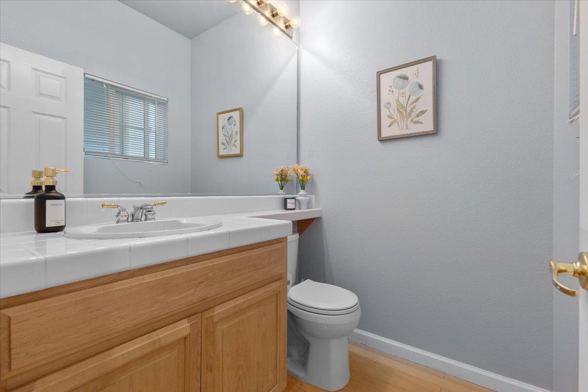 133 Cliff Swallow Court Brisbane, CA 94005 - Photo 9 of 39 a bathroom with a sink a toilet and mirror