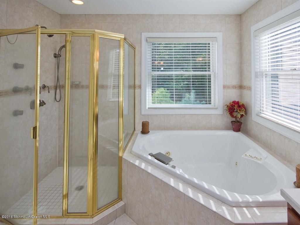 6 Applegate Road Millstone Township, NJ 08510 - Photo 21 of 40 a bathroom with a bathtub and shower
