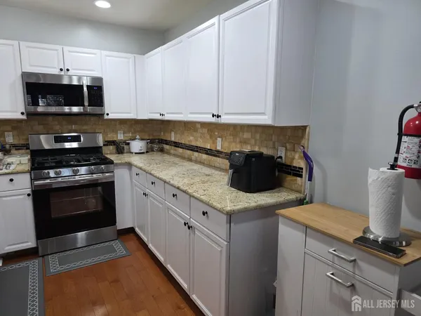 a kitchen with a sink and a stove top oven
