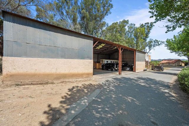 a view of street with parked cars