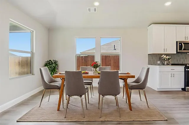 a view of a kitchen cabinets and a window