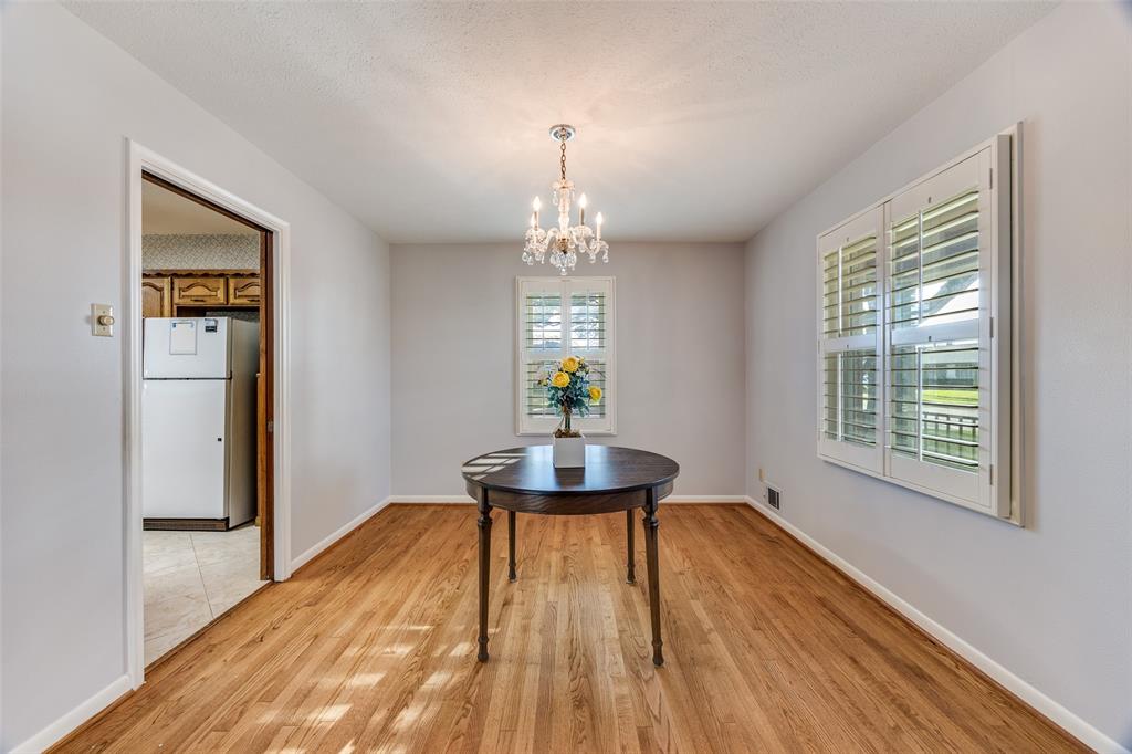 3019 Sharpview Lane Dallas, TX 75228 - Photo 14 of 26 a dining room with a table and chairs
