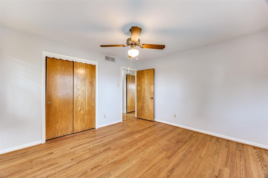 3019 Sharpview Lane Dallas, TX 75228 - Photo 19 of 26 a view of empty room with wooden floor