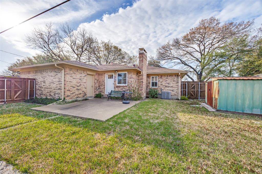 3019 Sharpview Lane Dallas, TX 75228 - Photo 22 of 26 a view of a house with a yard and garage