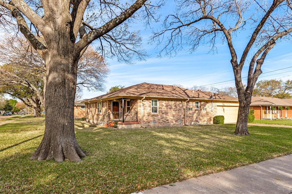 3019 Sharpview Lane Dallas, TX 75228 - Photo 25 of 26 a front view of a house with a yard