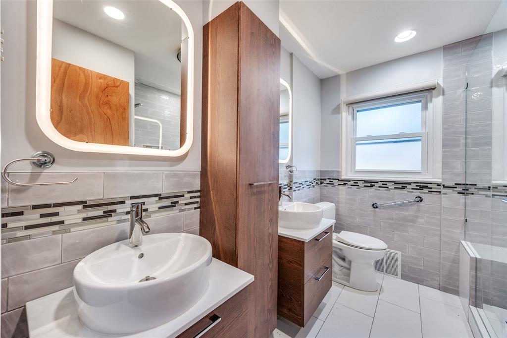 3019 Sharpview Lane Dallas, TX 75228 - Photo 6 of 26 a bathroom with a sink and a mirror