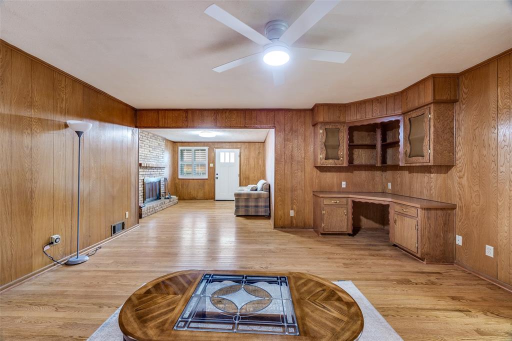 3019 Sharpview Lane Dallas, TX 75228 - Photo 7 of 26 a room with stainless steel appliances wooden floor and chandelier