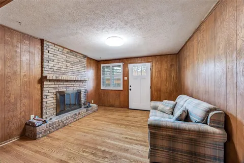 a living room with furniture window and a fireplace