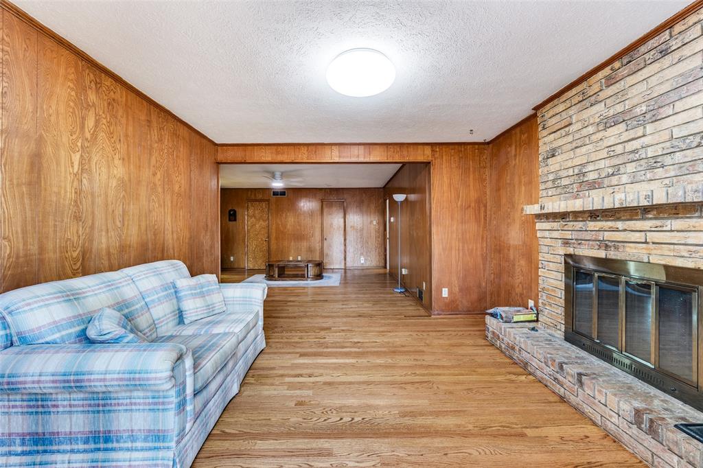 3019 Sharpview Lane Dallas, TX 75228 - Photo 9 of 26 a living room with furniture and a fireplace