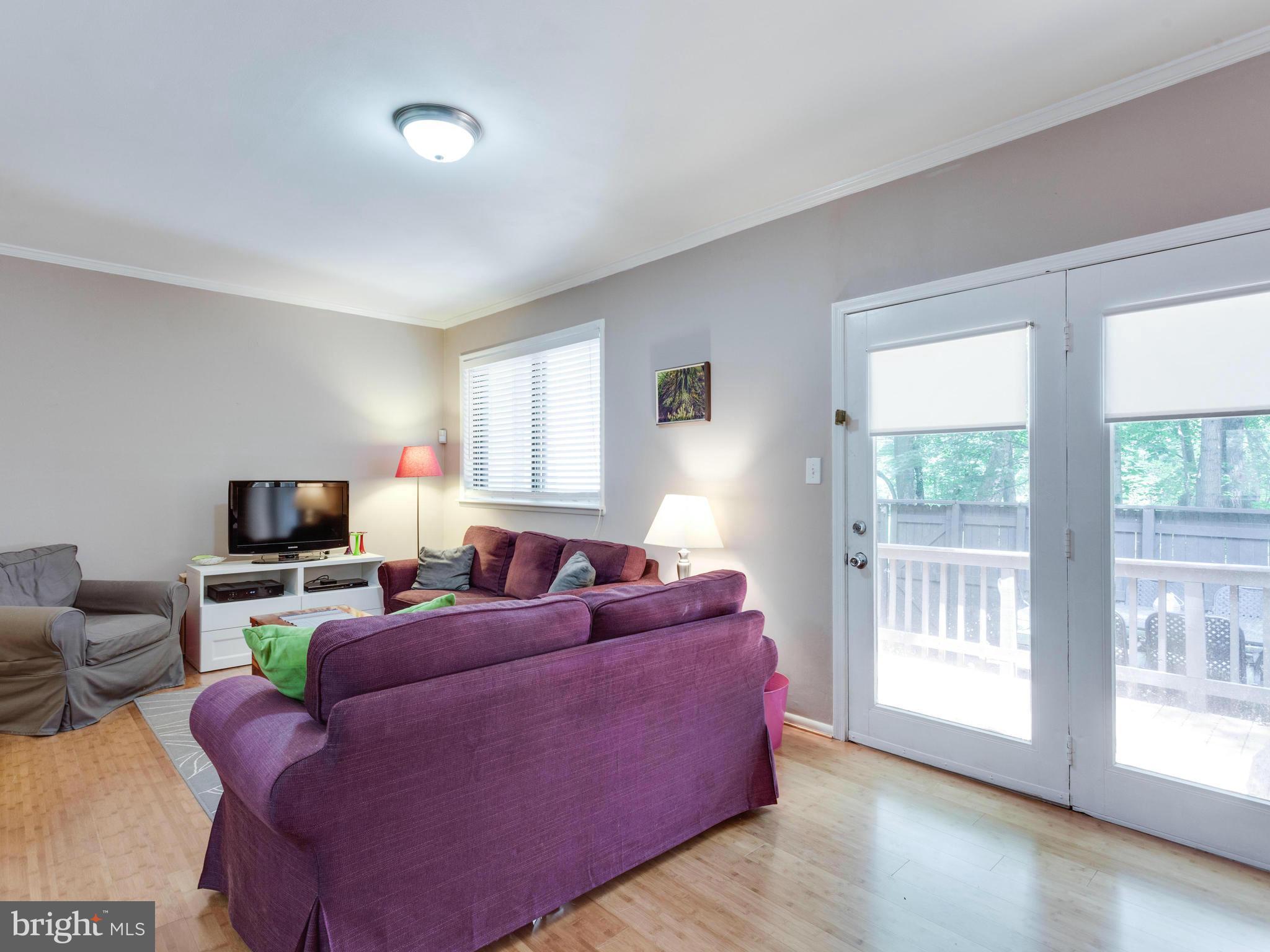 2334 Antiqua Court Reston, VA 20191 - Photo 12 of 30 a living room with furniture and a flat screen tv