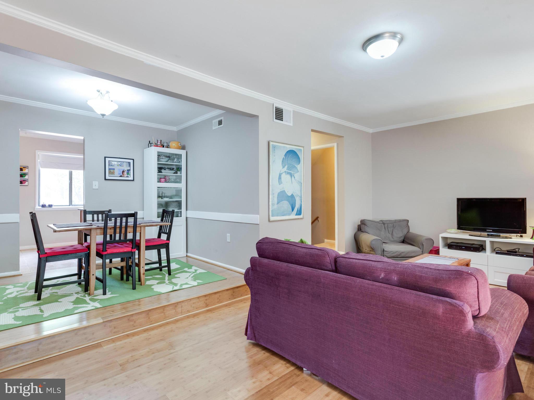 2334 Antiqua Court Reston, VA 20191 - Photo 13 of 30 a living room with furniture and a flat screen tv