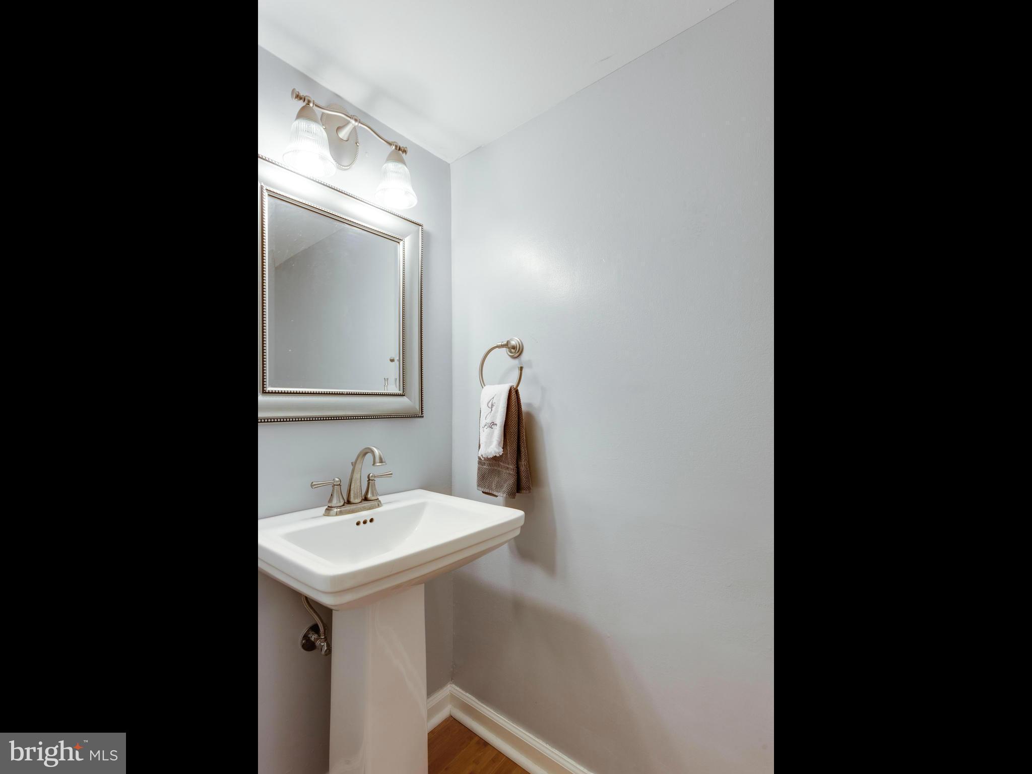 2334 Antiqua Court Reston, VA 20191 - Photo 15 of 30 a bathroom with a sink and a mirror