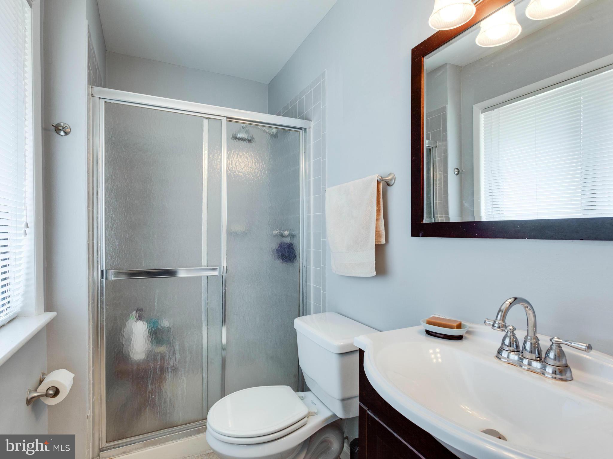 2334 Antiqua Court Reston, VA 20191 - Photo 22 of 30 a bathroom with a sink toilet and shower