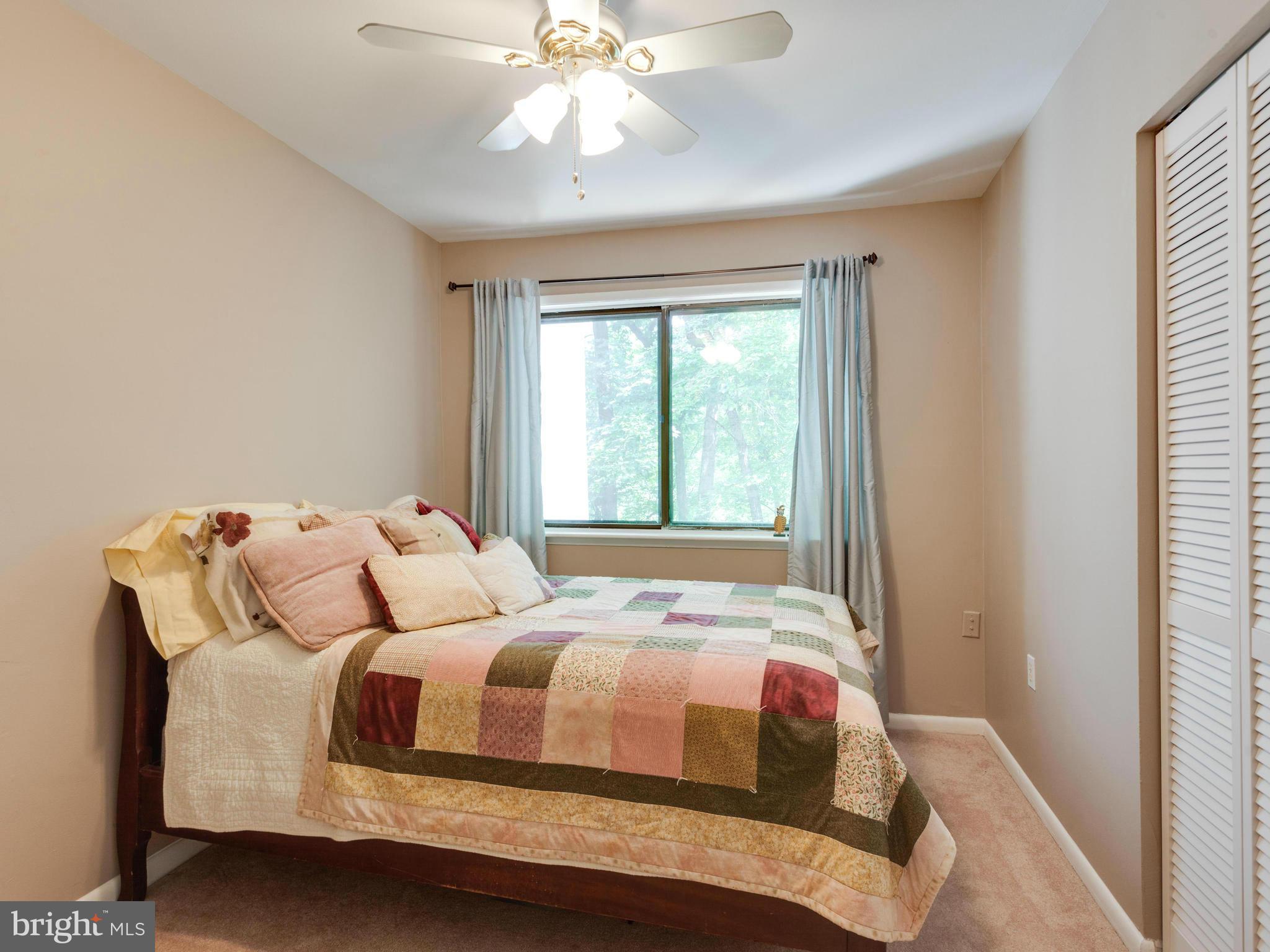 2334 Antiqua Court Reston, VA 20191 - Photo 23 of 30 a bedroom with a large bed and a window
