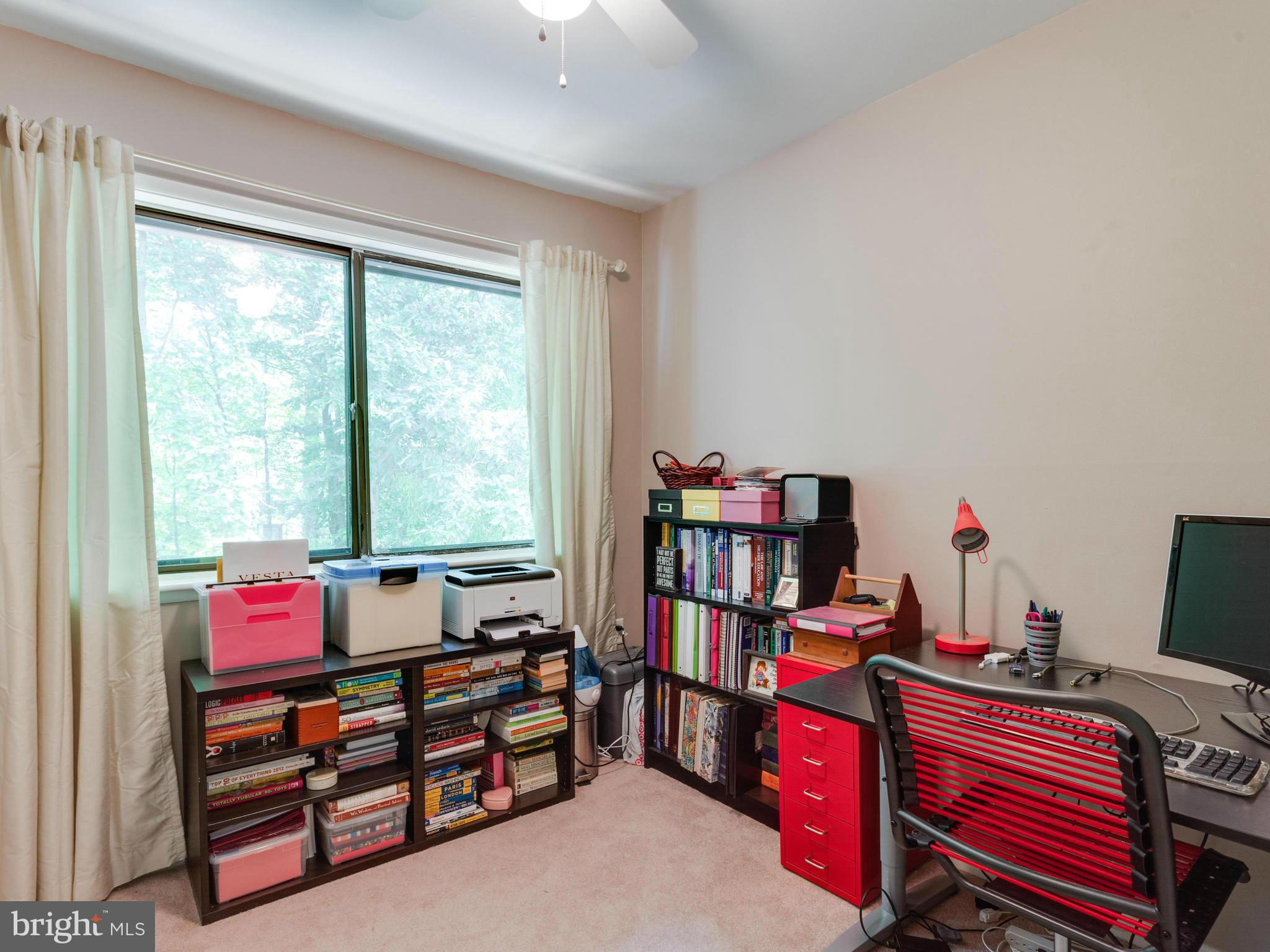2334 Antiqua Court Reston, VA 20191 - Photo 24 of 30 a bedroom with furniture and a book shelf