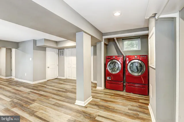 a view of an entryway door with wooden floor