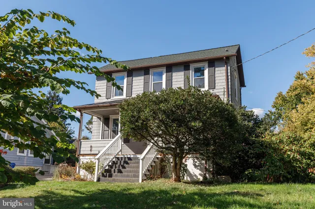 front view of a house with a garden