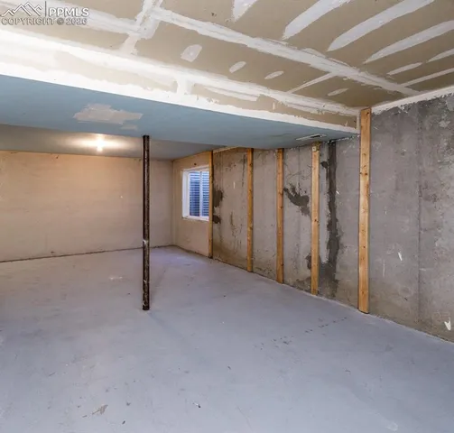 a view of main area with fireplace and wooden floor