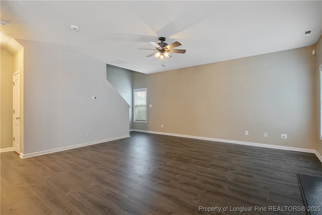 4964 Aberdeen Road Raeford, NC 28376 - Photo 13 of 50 a view of an empty room with window and wooden floor