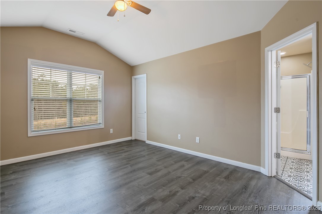 4964 Aberdeen Road Raeford, NC 28376 - Photo 22 of 50 a view of an empty room with window and wooden floor