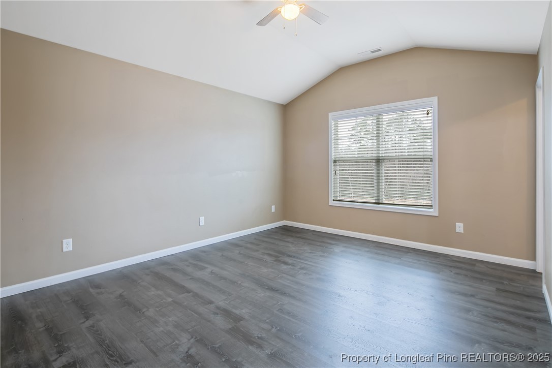 4964 Aberdeen Road Raeford, NC 28376 - Photo 25 of 50 a view of an empty room with wooden floor and a window