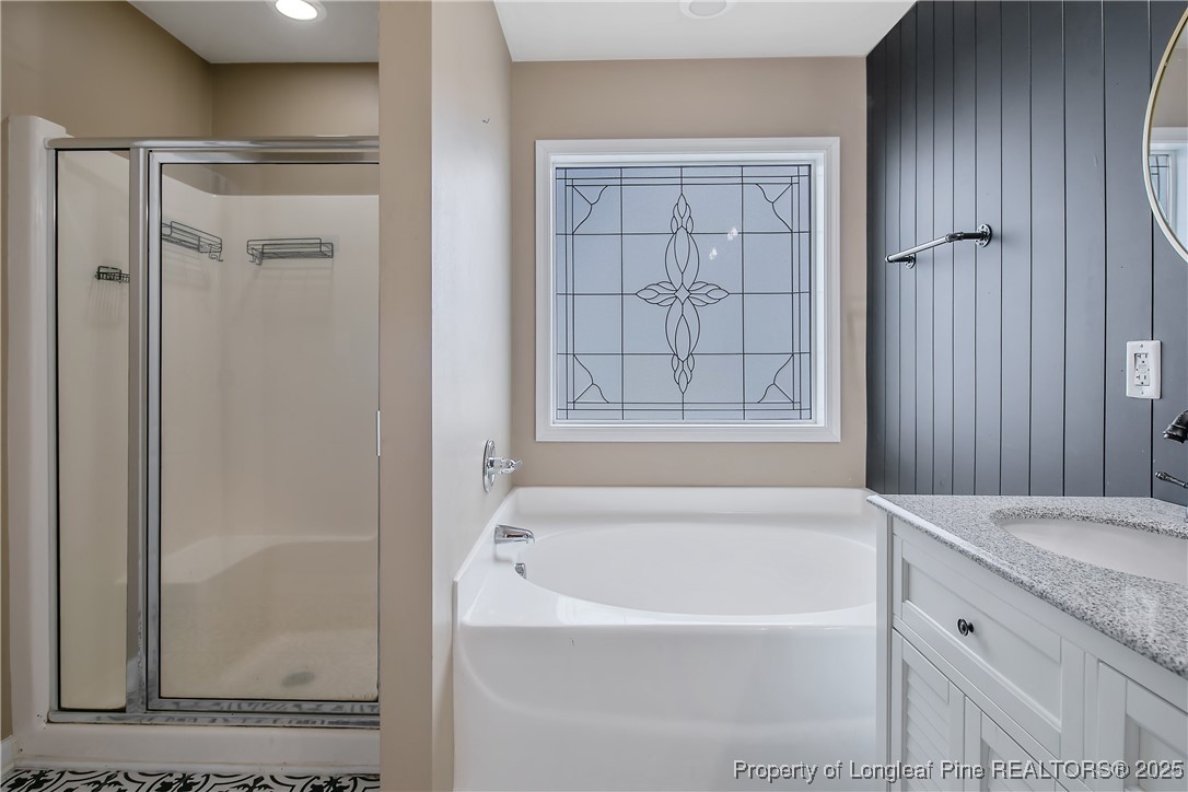 4964 Aberdeen Road Raeford, NC 28376 - Photo 28 of 50 a bathroom with a bathtub and shower