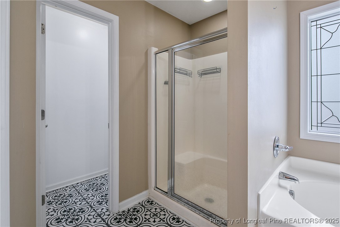 4964 Aberdeen Road Raeford, NC 28376 - Photo 29 of 50 a bathroom with a shower