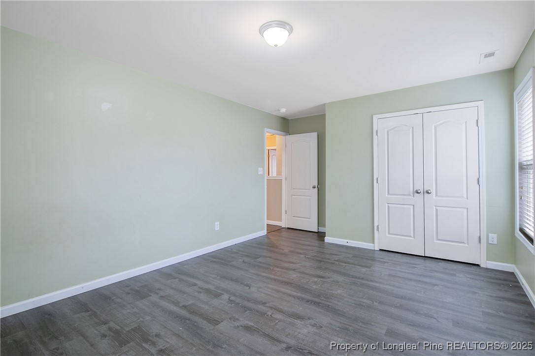 4964 Aberdeen Road Raeford, NC 28376 - Photo 33 of 50 a view of an empty room with wooden floor