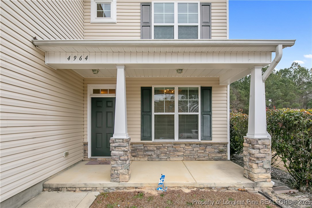 4964 Aberdeen Road Raeford, NC 28376 - Photo 4 of 50 a front view of a house with a yard and garage