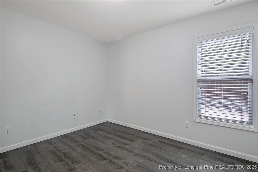 4964 Aberdeen Road Raeford, NC 28376 - Photo 45 of 50 wooden floor in an empty room with a window