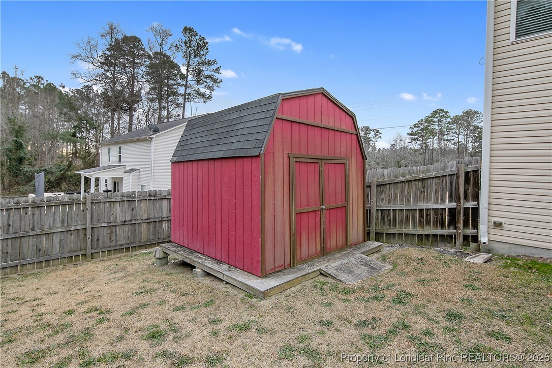 4964 Aberdeen Road Raeford, NC 28376 - Photo 49 of 50 a view of a house with a backyard and wooden fence