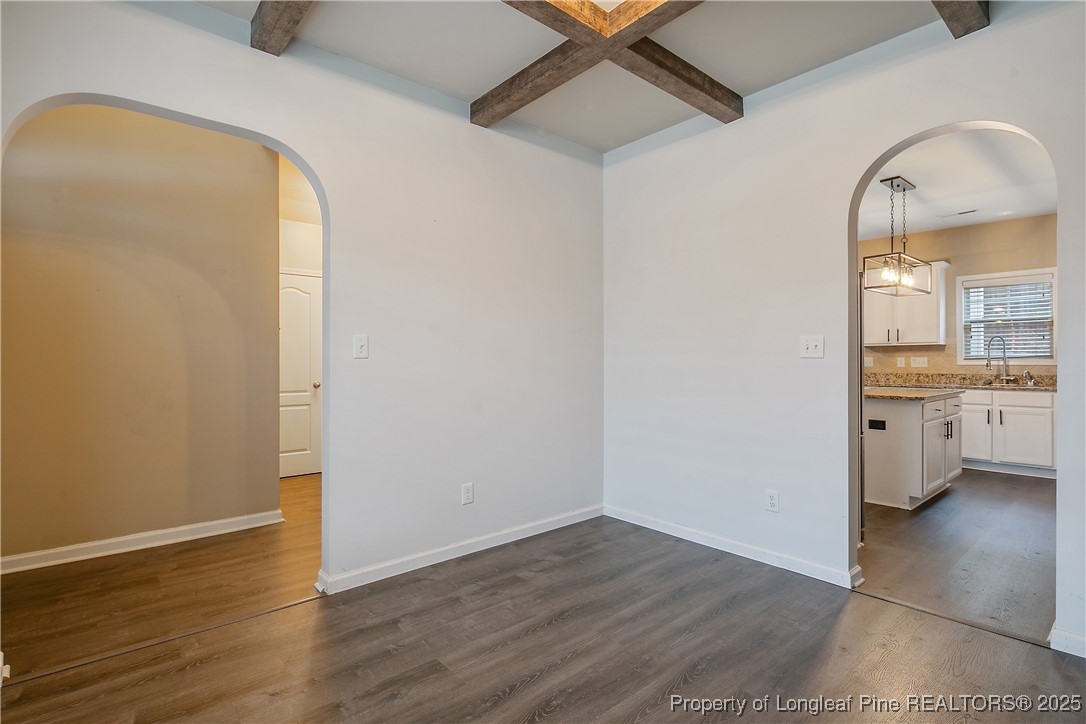 4964 Aberdeen Road Raeford, NC 28376 - Photo 8 of 50 an empty room with wooden floor and a window