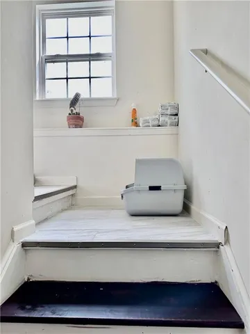 a bathroom with a sink and a window
