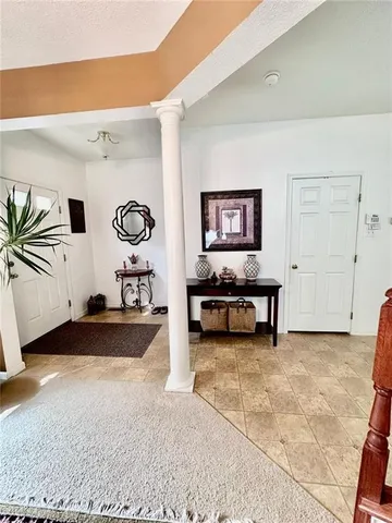 a view of a field with trees in the background