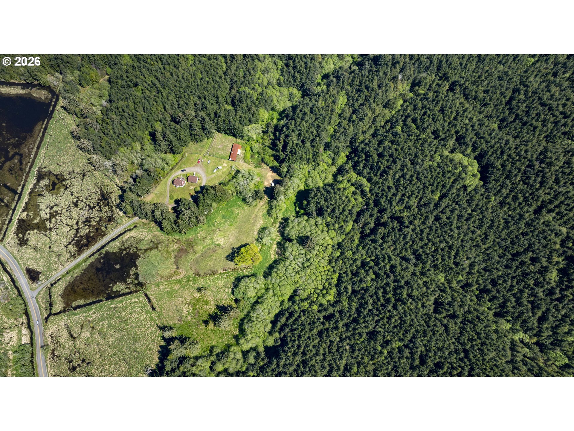 94010 North Way Lane North Bend, OR 97459 - Photo 11 of 21 a black and white photo of a green field