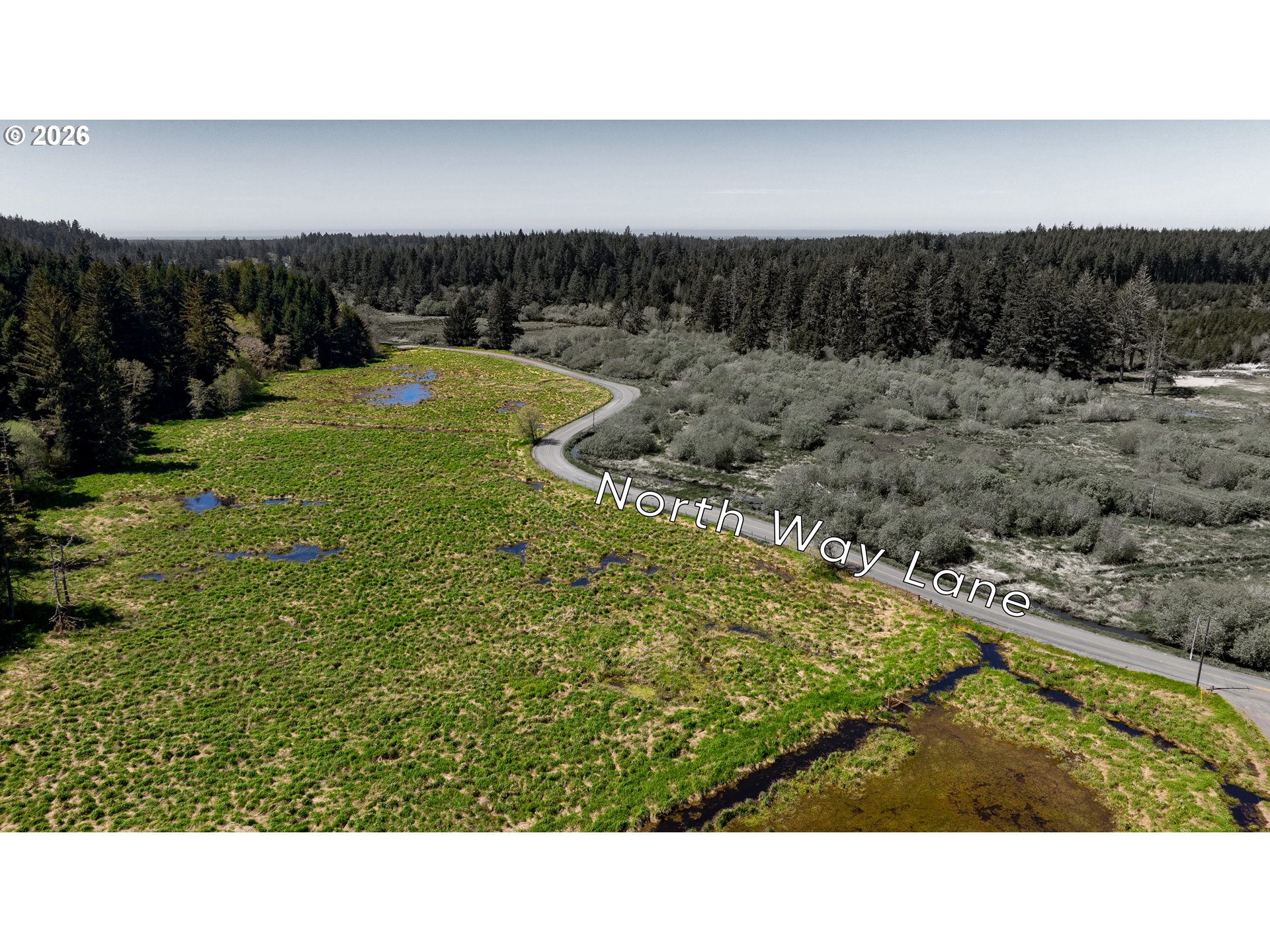 94010 North Way Lane North Bend, OR 97459 - Photo 3 of 21 a view of a yard with a swimming pool and sitting area