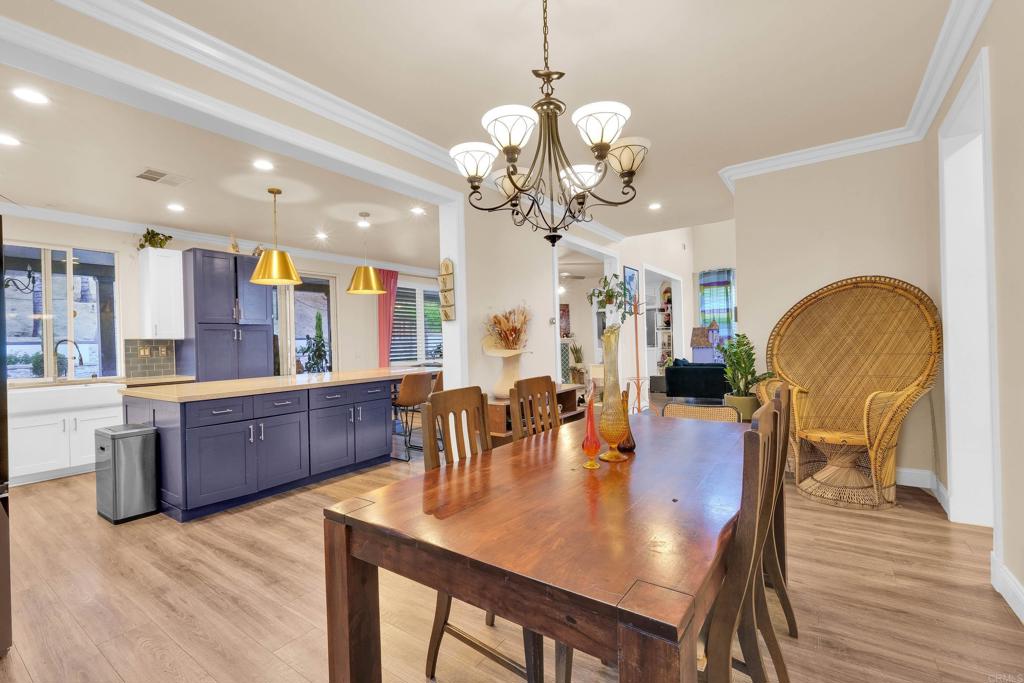 8359 Clover Creek Road Riverside, CA 92508 - Photo 13 of 42 a view of a dining room with furniture and wooden floor