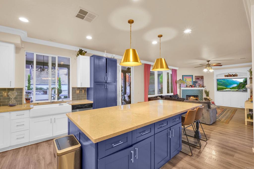 8359 Clover Creek Road Riverside, CA 92508 - Photo 15 of 42 a room with gym equipment and wooden floor