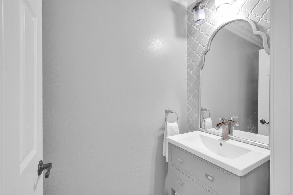 8359 Clover Creek Road Riverside, CA 92508 - Photo 19 of 42 a bathroom with a sink and a mirror