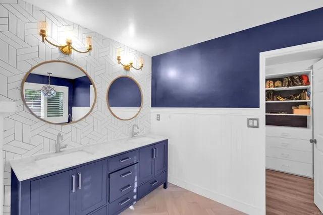 a bed room with furniture and a flat screen tv