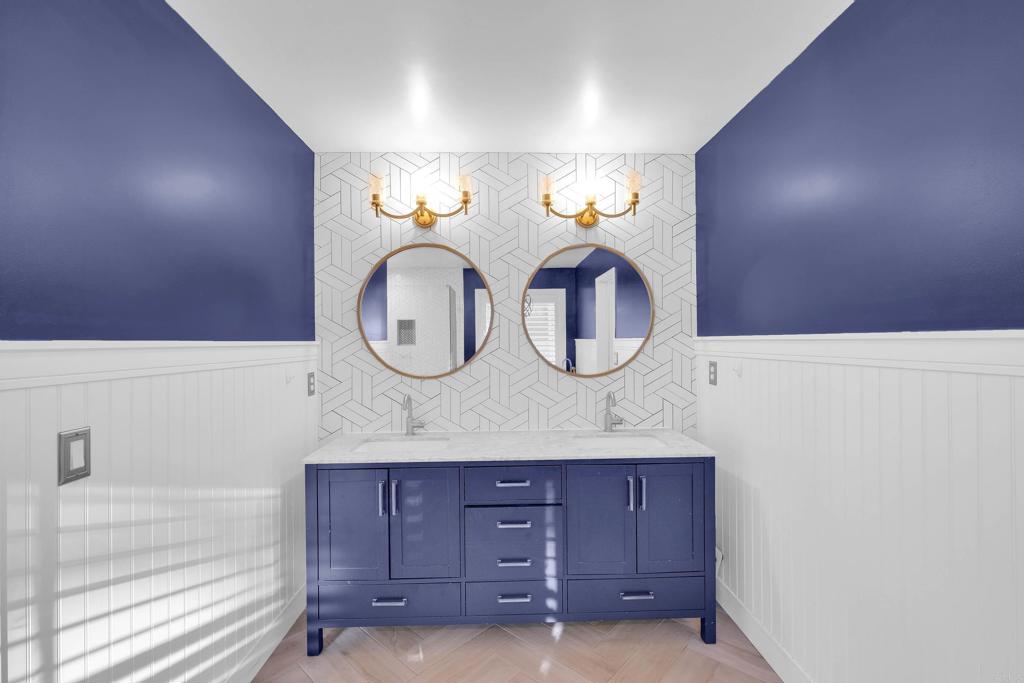 8359 Clover Creek Road Riverside, CA 92508 - Photo 26 of 42 a bathroom with a sink and a mirror