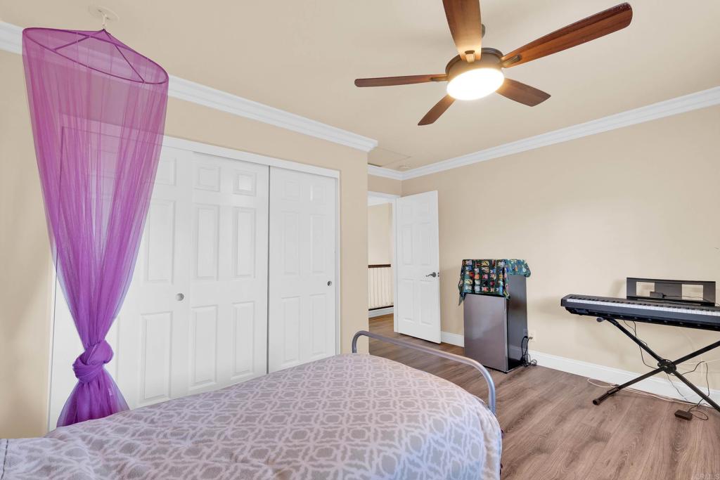 8359 Clover Creek Road Riverside, CA 92508 - Photo 28 of 42 a bedroom with a bed and a mirror