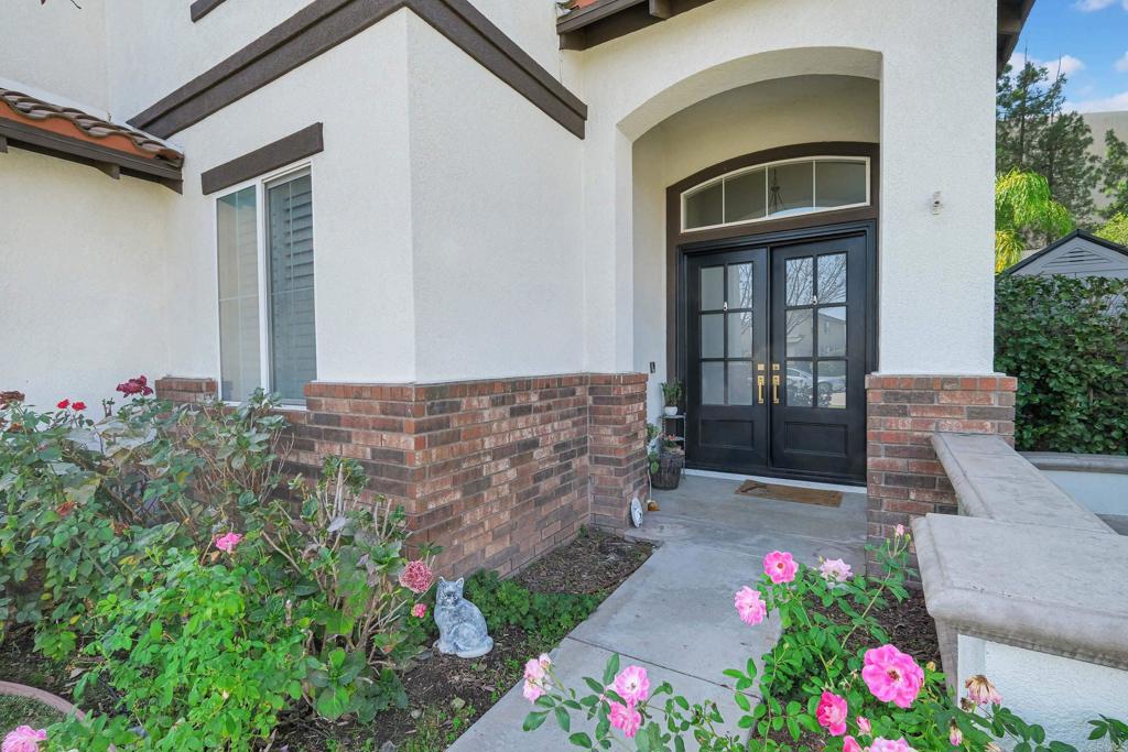 8359 Clover Creek Road Riverside, CA 92508 - Photo 3 of 42 a front view of a house with a yard