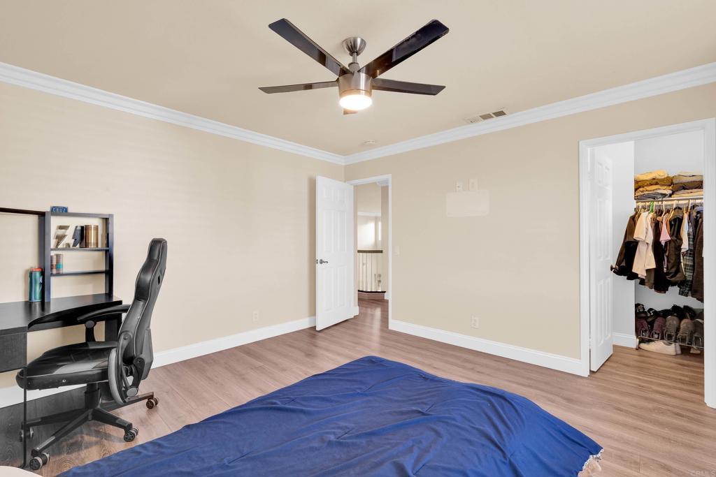 8359 Clover Creek Road Riverside, CA 92508 - Photo 31 of 42 wooden floor in a room with a window and a ceiling fan