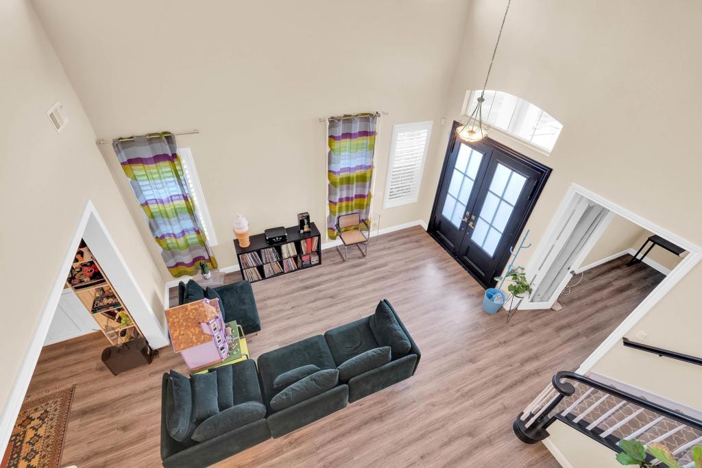 8359 Clover Creek Road Riverside, CA 92508 - Photo 33 of 42 a living room with furniture and a flat screen tv