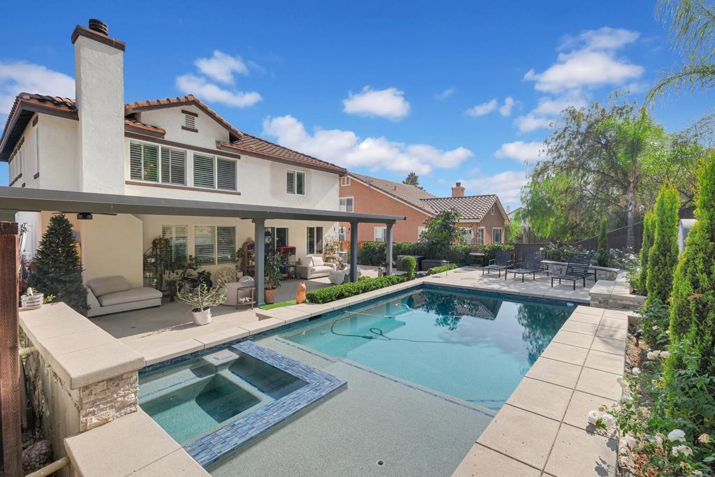 8359 Clover Creek Road Riverside, CA 92508 - Photo 35 of 42 a front view of a house with swimming pool